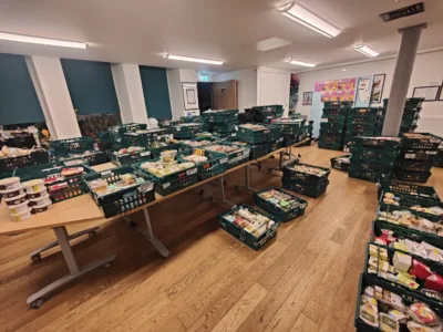 A room with all surfaces covered with crates of food